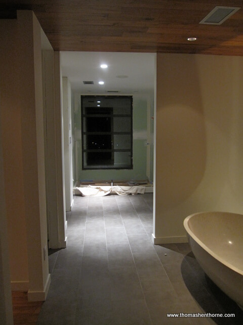 Photo of bathroom remodel with drywall and bath tub to the right