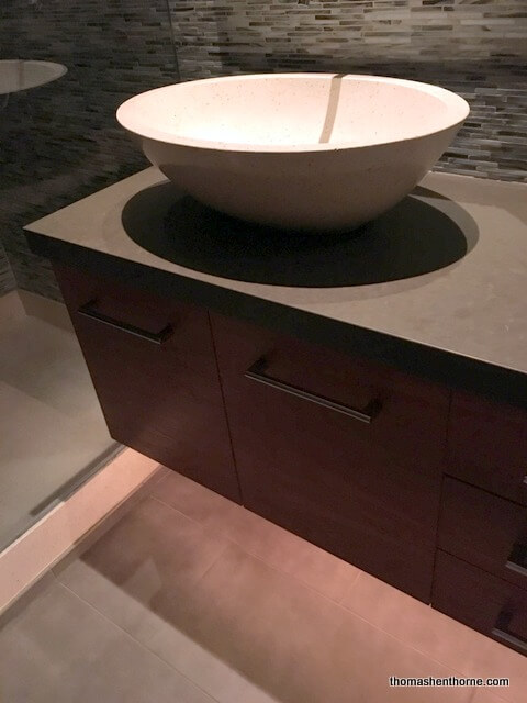 photo of floating sink cabinet with undercabinet lighting bathroom remodel