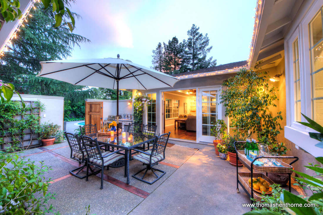 Outdoor Dining Area With Pool in Distance