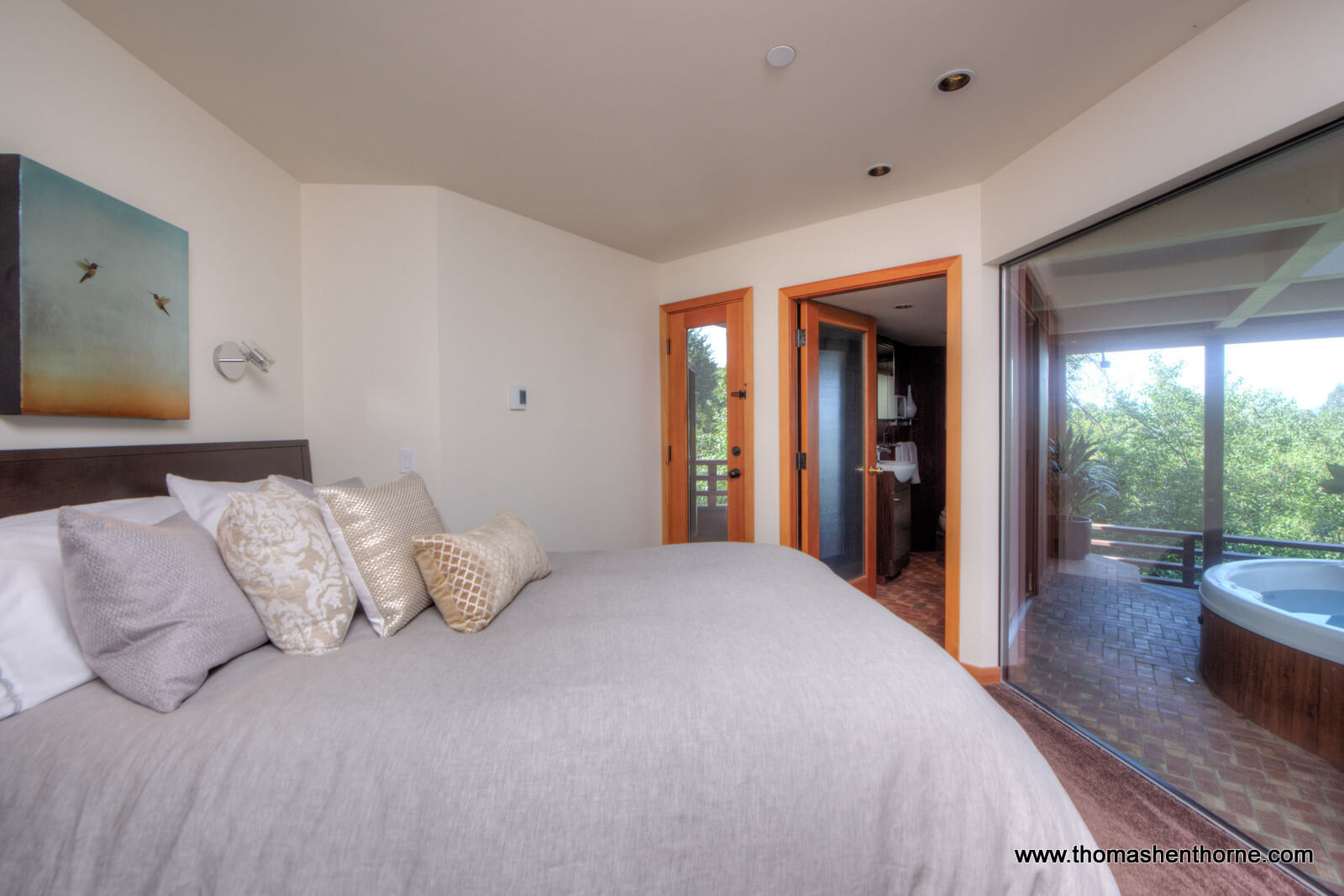 master bedroom photo with hot tub deck at right