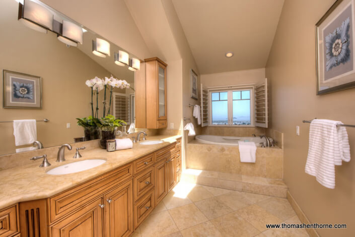 Photo of master bathroom with double sinks and view tub