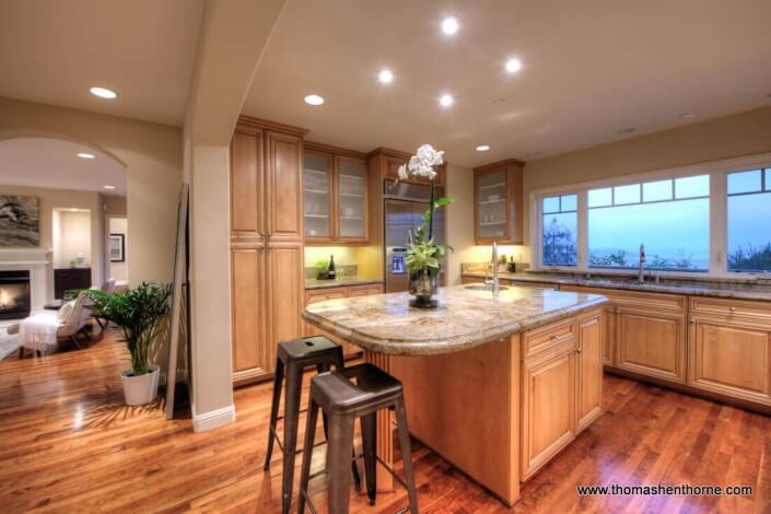 Photo of kitchen and living room beyond