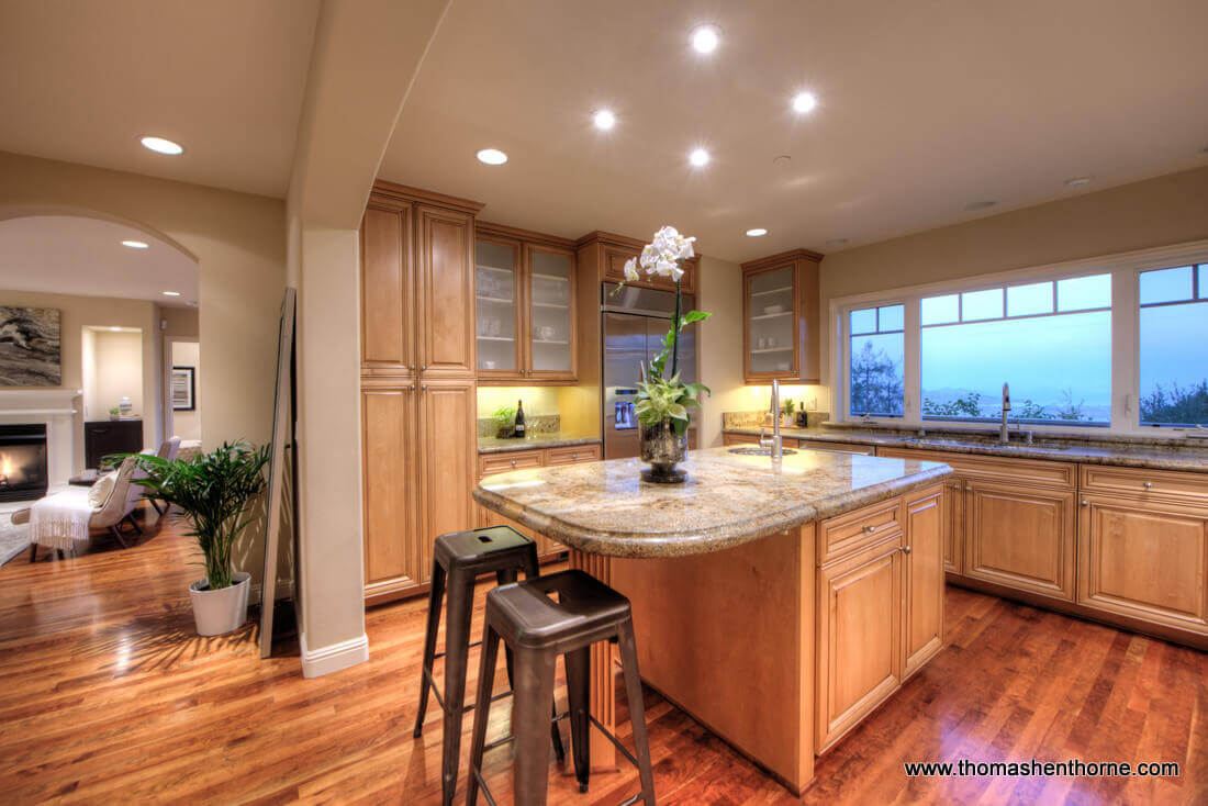 Photo of kitchen and living room beyond