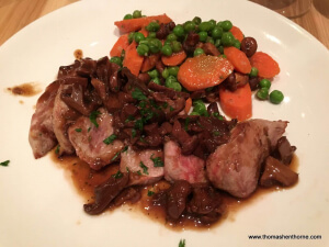 pork dish with peas and carrots