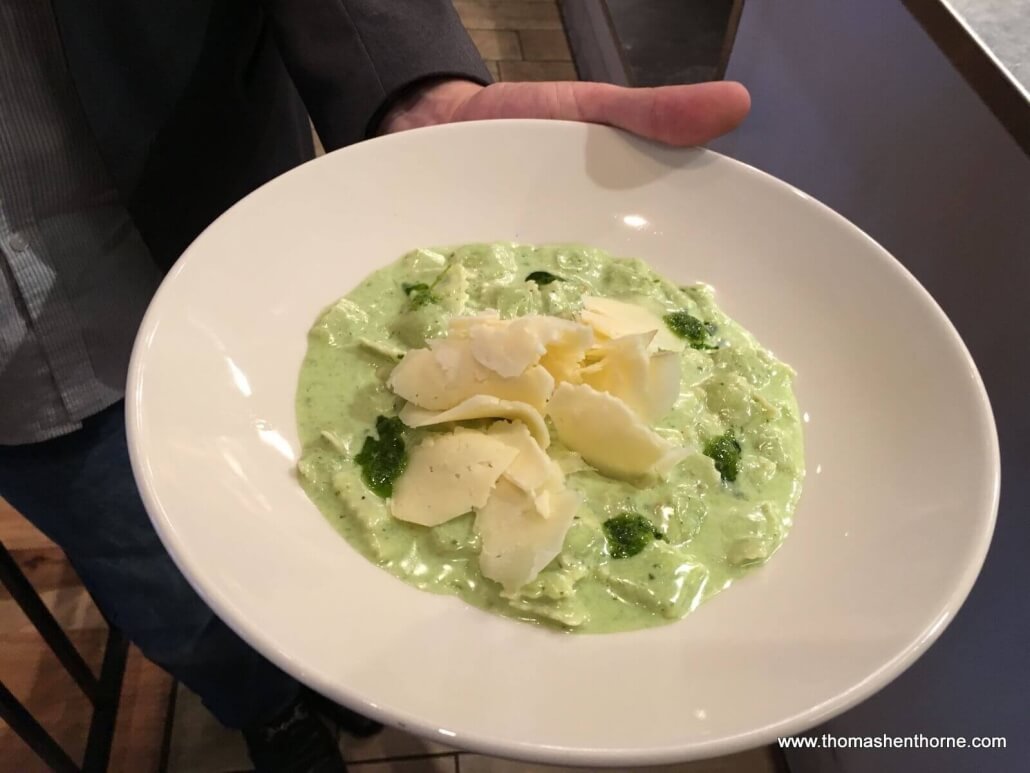 Plate of ravioli topped by cheese