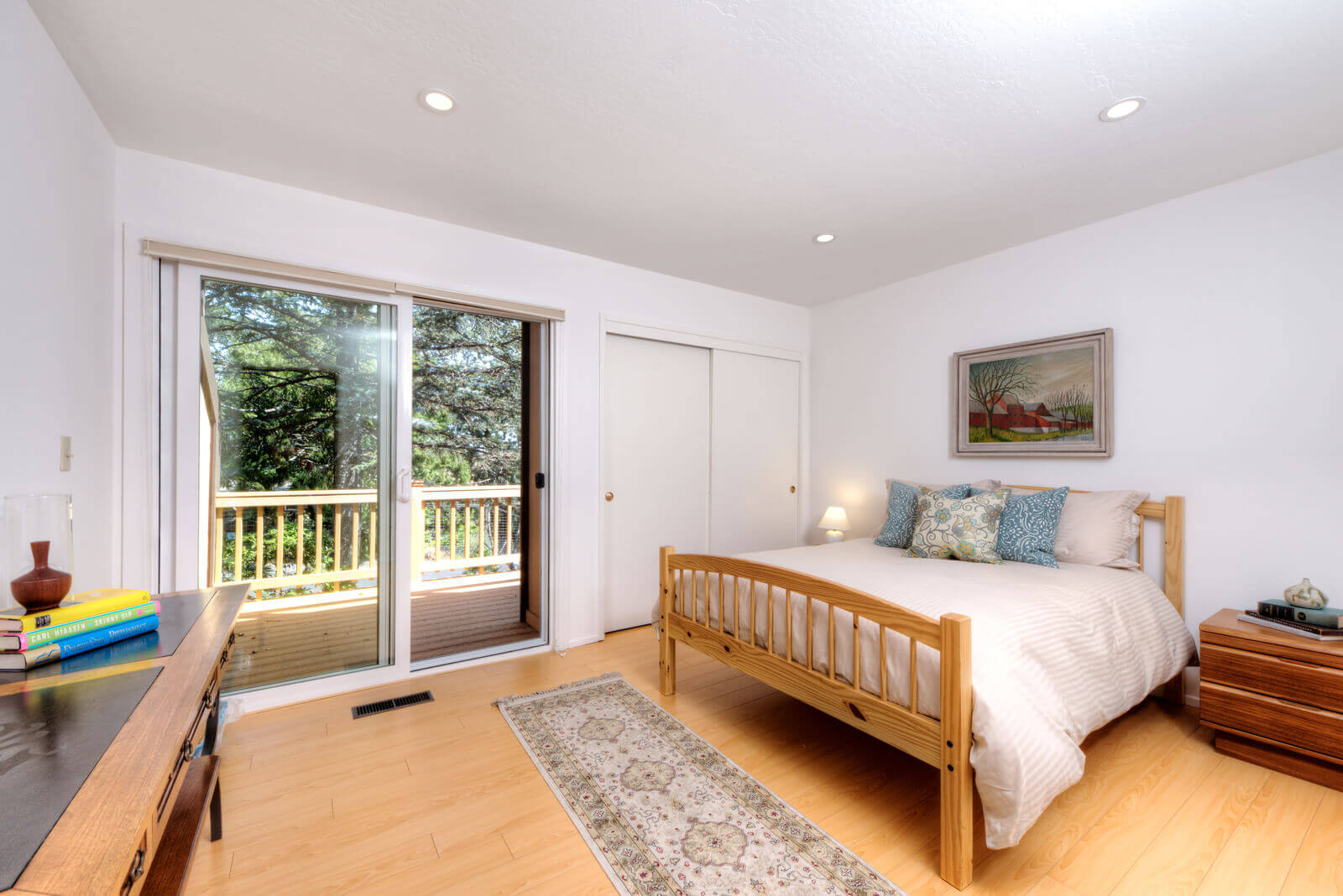 Bedroom with glass sliding doors out to deck