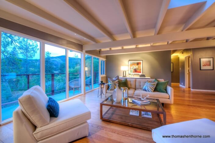 living room with walls of glass views