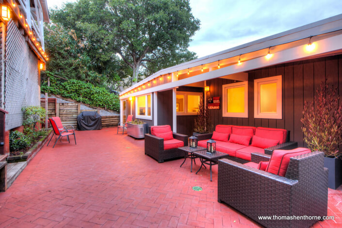 photo of front brick patio with outdoor seating area