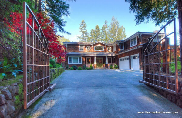 8 Woodland Place front entry gate and home with brown shingles and white trim