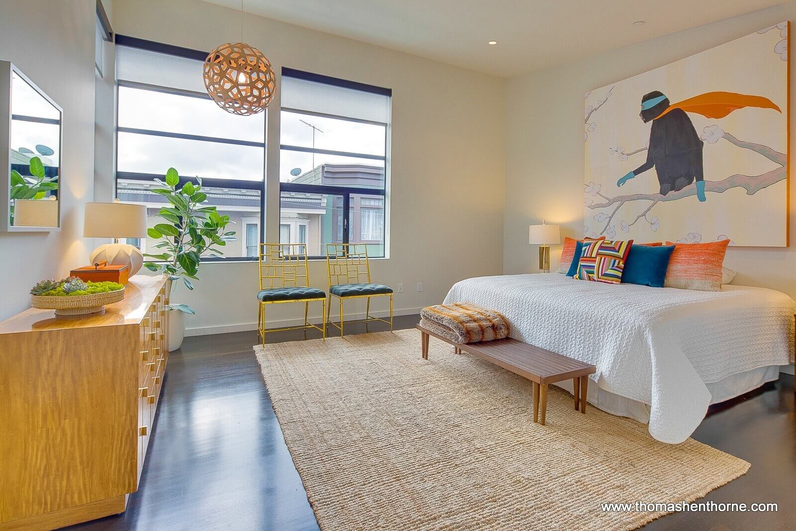 Bedroom with windows looking out onto street