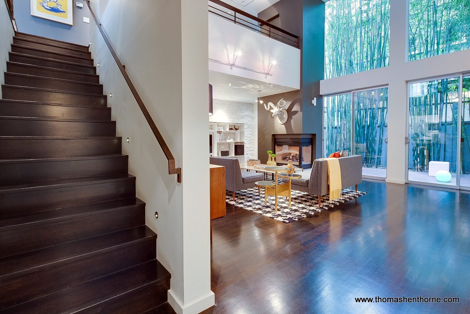 Entering living room with view of timber bamboo and wall of glass