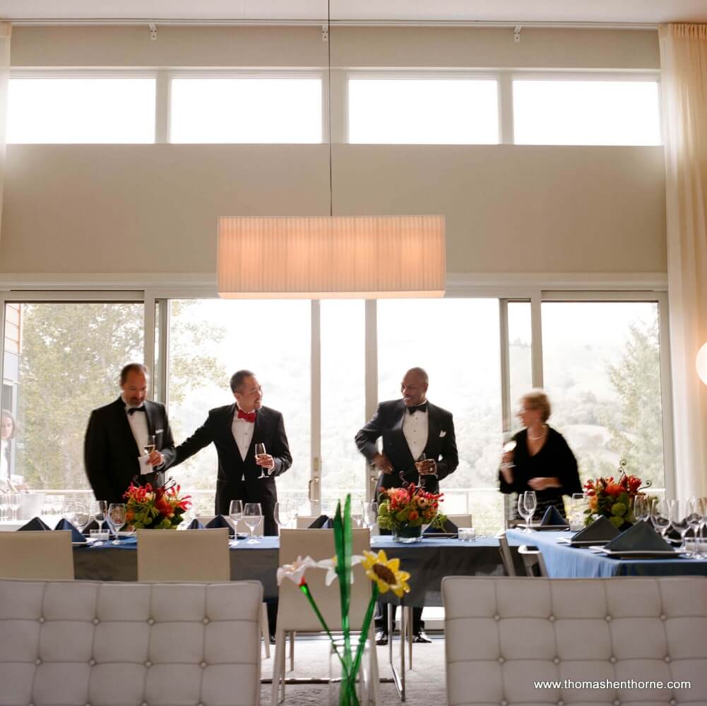 Guests holding wine glasses