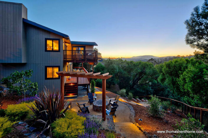 Back yard with fire pit at twilight