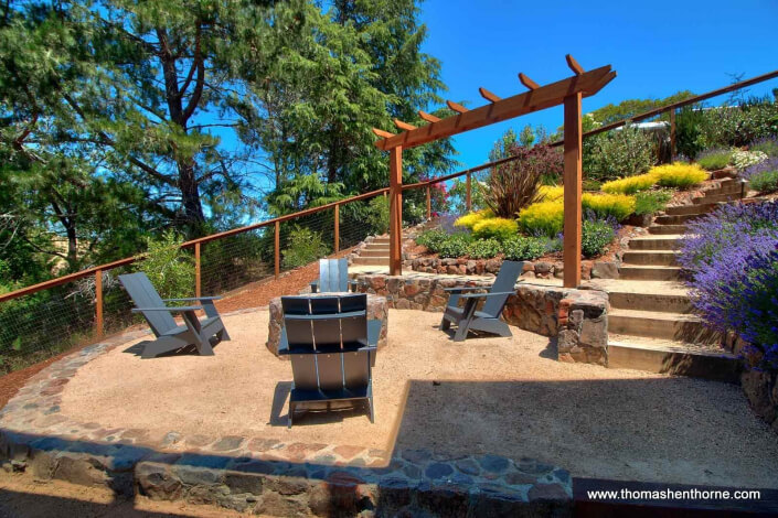 Fire pit with garden and stairs and trellis