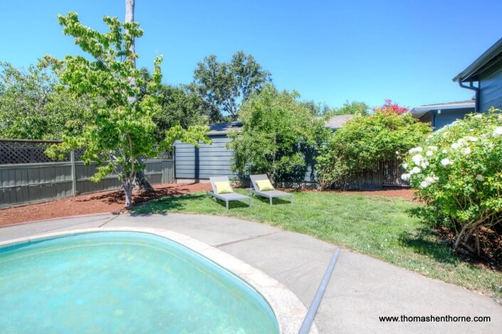 Pool with yard and chaise lounges