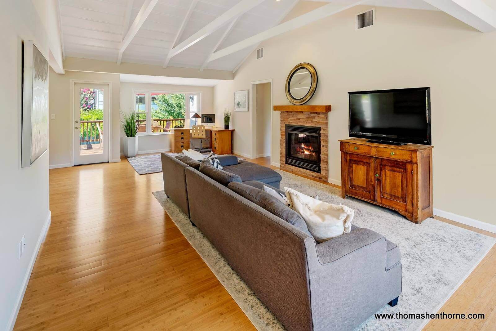 Living Room with fireplace TV and cathedral ceilings