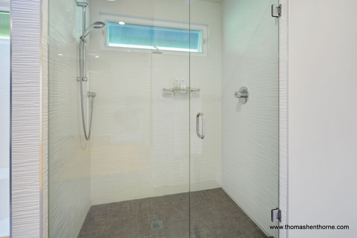 Master shower with glass surround and modern tile