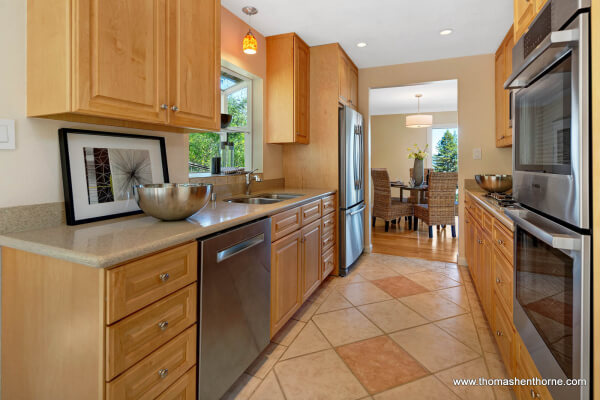 Galley kitchen with stainless appliances