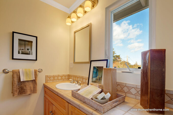 Master bathroom with window over vanity