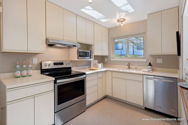 kitchen with stainless appliances and light colored cabinetry