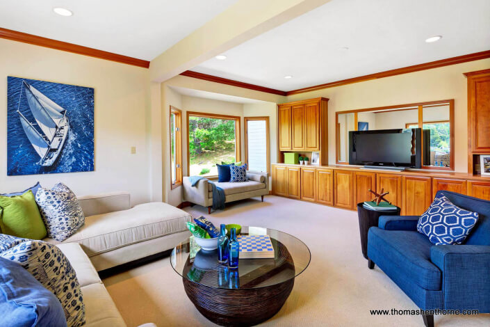 Family room with television and cabinets