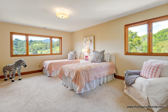 Bedroom with Two Twin beds with pink comforters