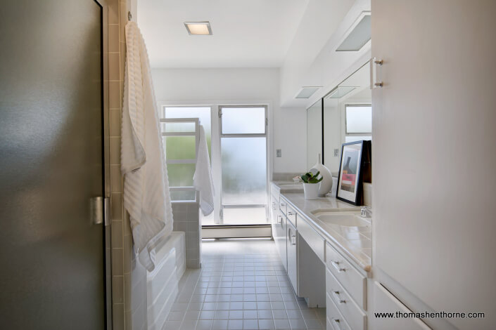 Bathroom with tile floor and frosted windows