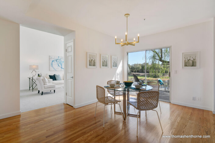 Kitchen table with living room through door