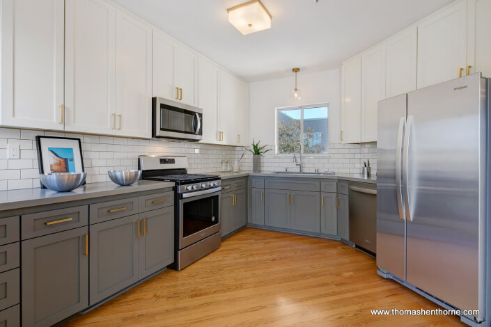 Kitchen with subway tiles and stainless steel appliances