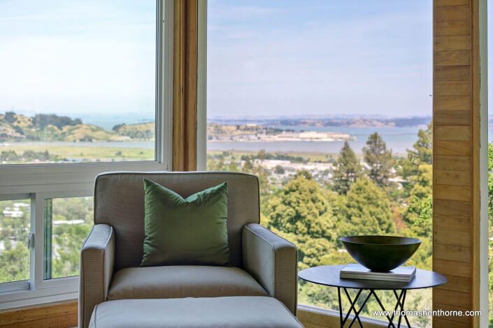 Upholstered chair in window