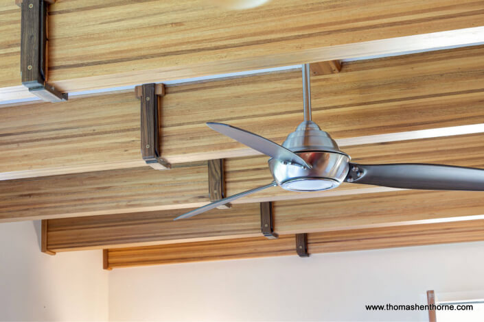 Modern ceiling fan and wood ceiling beams