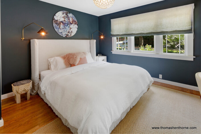 Master bedroom with blue walls and white trim