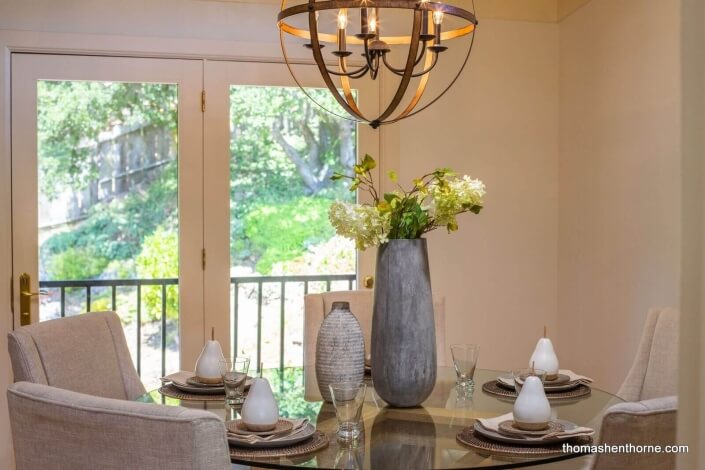 Round glass dining table and chandelier