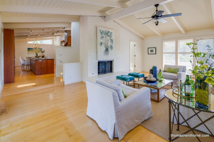 Open living room and kitchen with open beam ceiling