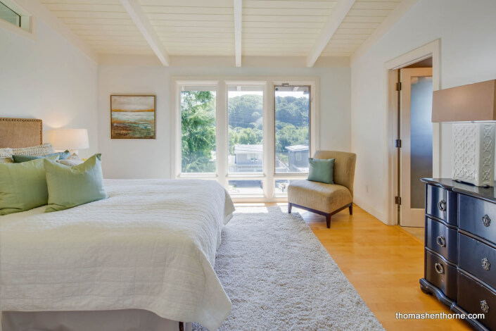 Master bedroom with exposed beam ceiling