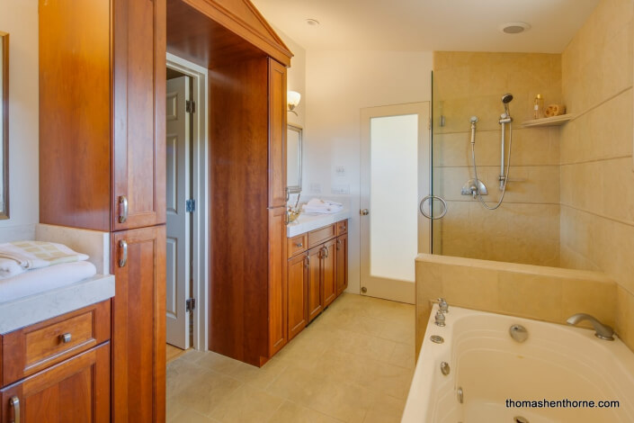 Master bathroom with jetted tub and glass enclosed shower