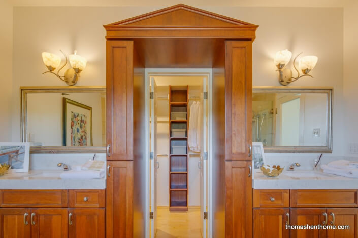 Master bathroom with dual vanity and custom woodwork