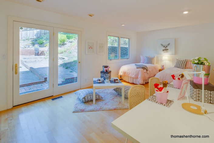 Bedroom with large glass doors to outside patio