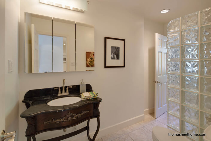 bathroom with ornate wood vanity