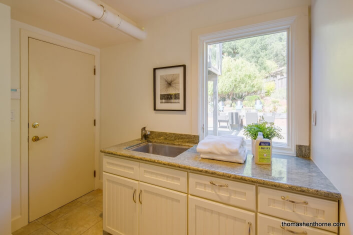 laundry room sink with granite counter