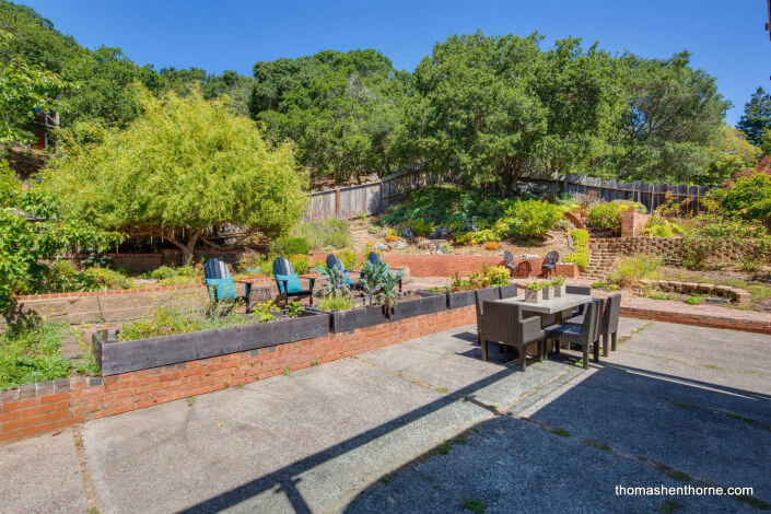 Patio with dining table and chairs