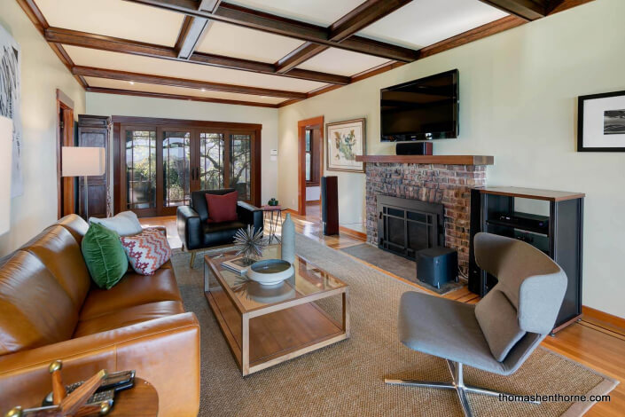 Room with brick fireplace and leaded windows