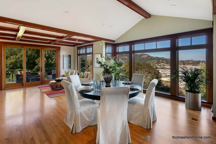 Room with hardwood floors and cathedral ceilings