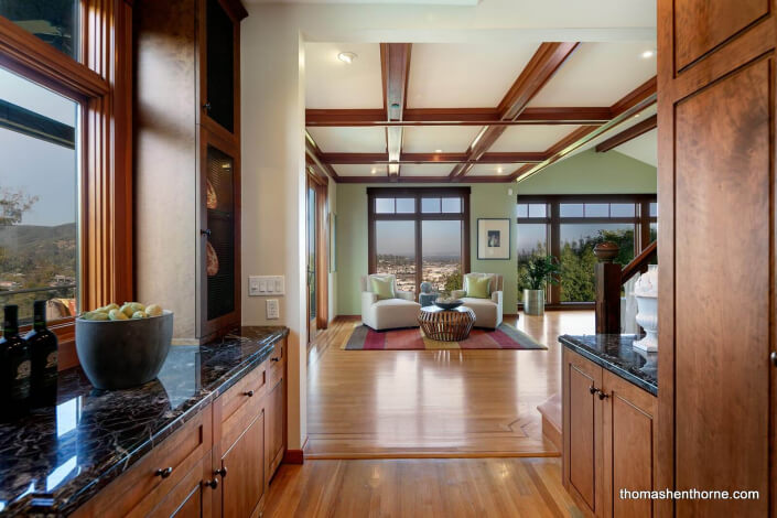 Room with hardwood floors and coffered ceilings