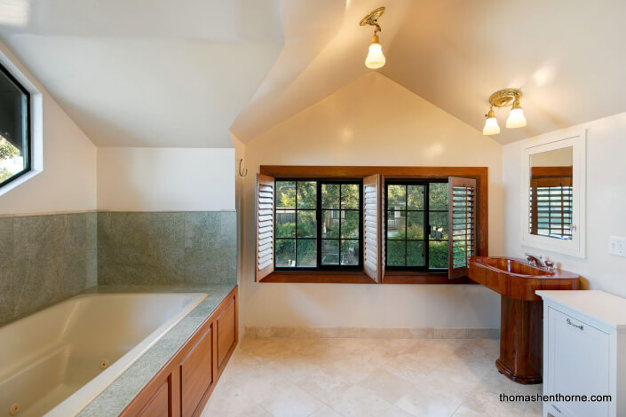 Bathroom with wood sink and jetted tub