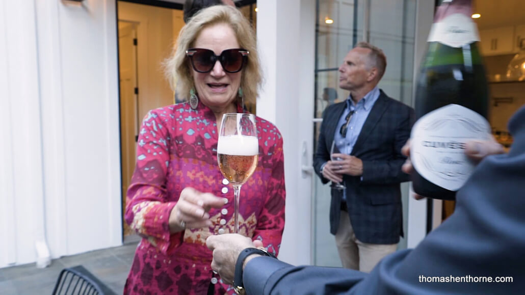 Woman accepting champagne glass