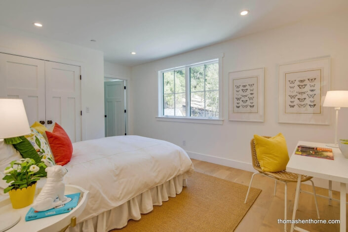 Bedroom with red pillow on bed