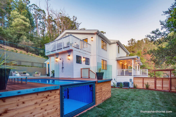 Modern farmhouse with shipping container pool