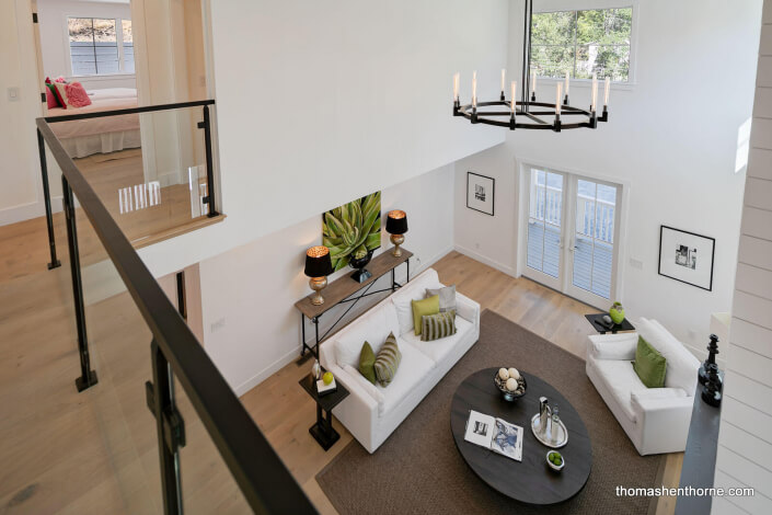 View of living room with sofa and two chairs from above