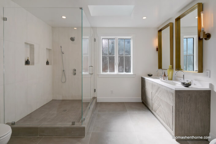 Modern master bathroom with glass shower surround